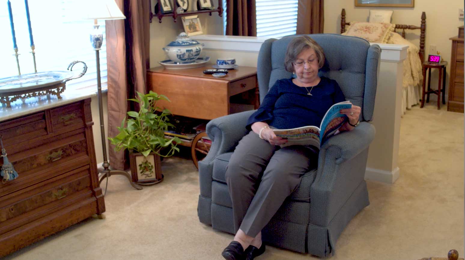 senior woman reading in her apartment